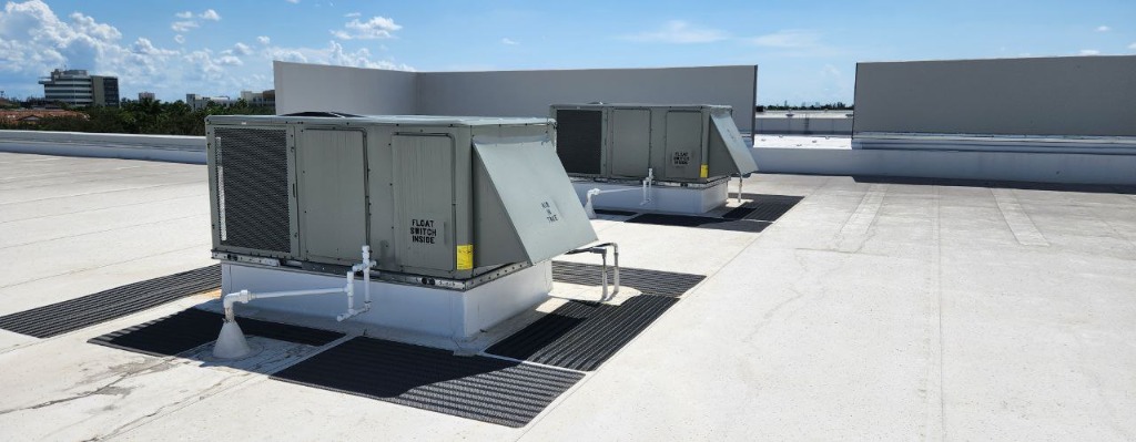 Professional HVAC technician servicing commercial units - Slide 2